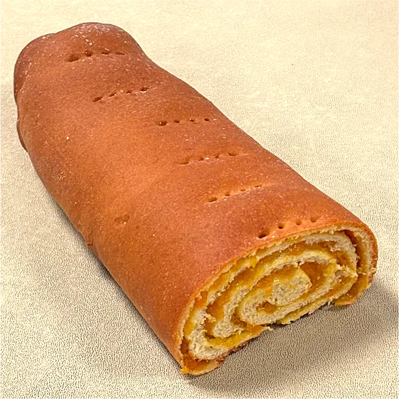 An apricot roll, cut to show the filling