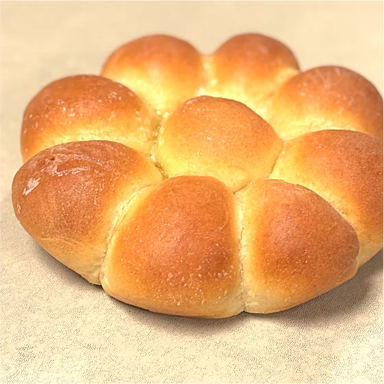 Cheese bread, baked as a round of pull-apart rolls
