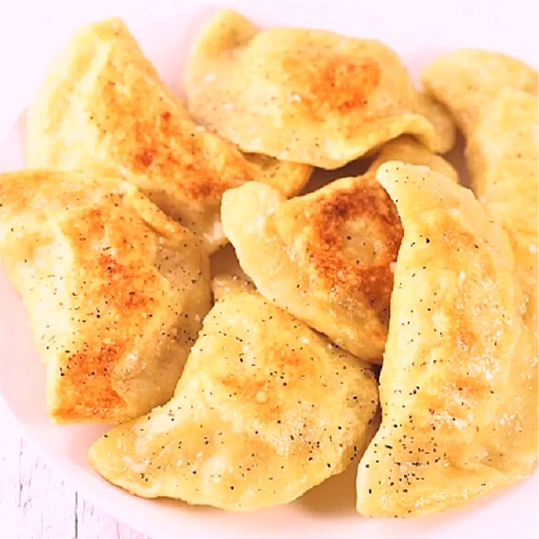 A plate of perohi, browned in butter